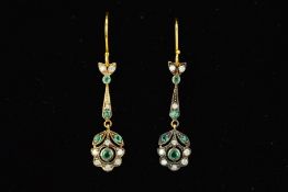 A PAIR OF REPRODUCTION EMERALD AND DIAMOND DROP EARRINGS designed as an emerald and diamond floral