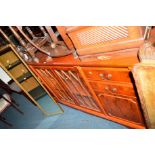 A MODERN YEW WOOD GLAZED BOOKCASE/SIDEBOARD with four drawers, approximate width 194cm, a modern