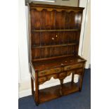 A NARROW TITCHMARSH AND GOODWIN OAK DRESSER the upper section with a two tier plate rack above a