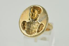 A SEAL RING, oval head depicting a gentleman in classic attire