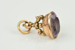 A 9CT GOLD AMETHYST SEAL FOB, an oval mixed cut amethyst measuring approximately 18mm x 13mm, fob