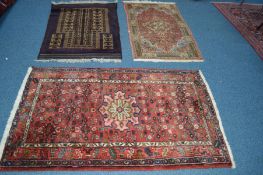 A 20TH CENTURY KHAMSEH RUG, red ground 165cm x 103cm, together with a Yomut rug and a Sultanabad rug