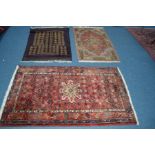 A 20TH CENTURY KHAMSEH RUG, red ground 165cm x 103cm, together with a Yomut rug and a Sultanabad rug