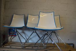 A SET OF FOUR SCAB DESIGN SWIVEL ZEBRA BILOCORE CHAIRS, white and pale blue, raised on four chrome