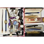 A SELECTION OF WATCHES AND PENS IN TWO BOXES to include stainless steel and leather strap