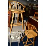 A PAIR OF LIGHT OAK SWIVEL BAR STOOLS