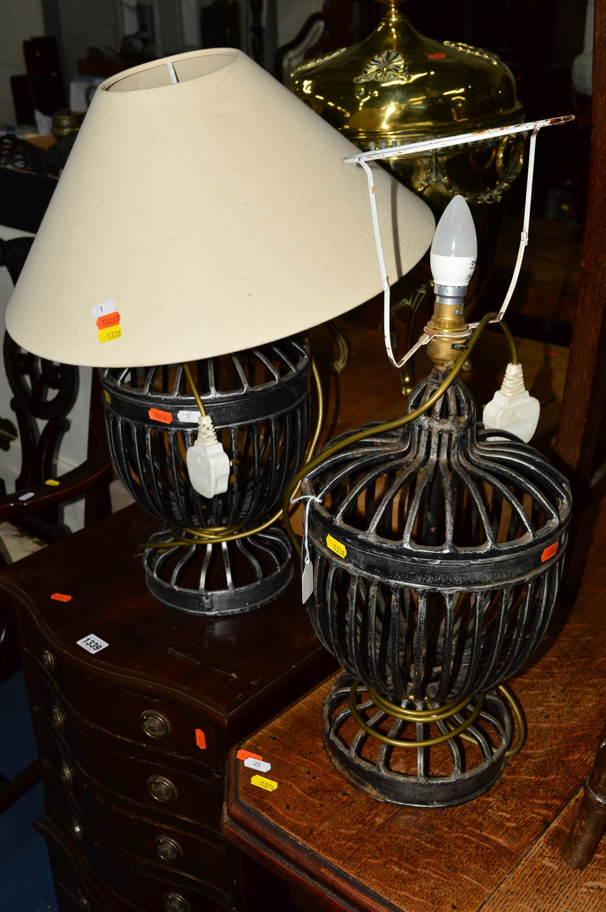 A PAIR OF WROUGHT IRON TABLE LAMPS (one with a shade)