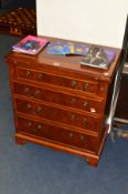 A REPRODUCTION GEORGIAN STYLE MAHOGANY, WALNUT AND BANDED CHEST, of four long graduated drawers, the