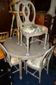 A GREY PAINTED CIRCULAR EXTENDING DINING TABLE on fluted legs, diameter 120cm x height 76cm,