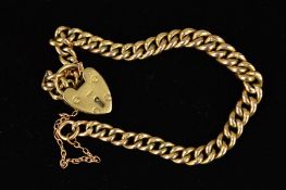A 9CT GOLD CURB LINK BRACELET, the graduated curb link bracelet with a heart padlock clasp and