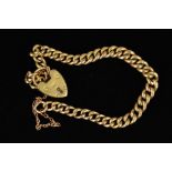 A 9CT GOLD CURB LINK BRACELET, the graduated curb link bracelet with a heart padlock clasp and