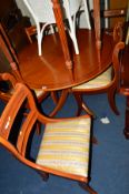 A YEW WOOD CIRCULAR TABLE and four chairs (5)
