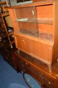 AN ART DECO WALNUT GLAZED BOOKCASE, together with a mahogany chest of two short and two long drawers