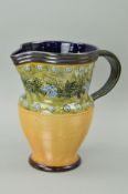 A DOULTON LAMBETH STONEWARE JUG, florally decorated, height 21cm