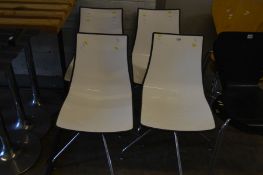 A SET OF FOUR SCAB DESIGN SWIVEL ZEBRA BILOCORE CHAIRS, white and black, raised on four chrome