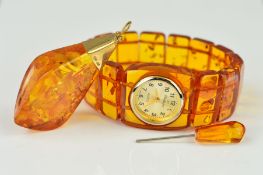 A MODIFIED AMBER WATCH AND PENDANT, the Challenger quartz watch with rectangular modified amber