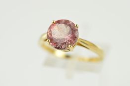 A MODEN PINK QUARTZ SINGLE STONE RING, a round mixed cut pink quartz displaying interesting internal