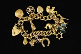 A 9CT GOLD CHARM BRACELET, the curb link bracelet suspending thirteen charms to include a kangaroo