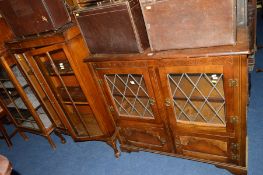 AN OAK GLAZED TWO DOOR BOOKCASE and another oak bookcase (2)
