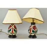 A PAIR OF MOORCROFT TABLE LAMPS WITH SHADES, stylized Birds & Trees, approximate height 22cm (not