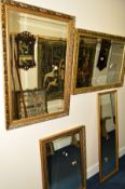 A PAIR OF FOLIATE GILT FRAMED BEVELLED EDGE WALL MIRRORS, 97cm x 66cm, together with two other