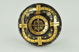 A LATE VICTORIAN TORTOISESHELL PIQUE BROOCH of circular outline inlaid with gold decorative