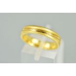 A BAND RING with central wavy polished line to the matt outer surround with 18ct gold convention