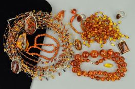 A SELECTION OF MAINLY MODIFIED AMBER JEWELLERY to include polished amber piece necklaces, a