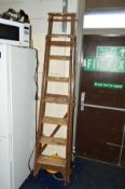 A TALL WOODEN STEP LADDER