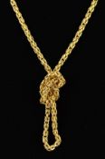 A 9CT GOLD CHAIN NECKLACE designed as a Byzantine chain to the push piece clasp with figure of eight