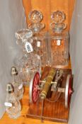THREE CUT GLASS DECANTERS, a cut glass two piece cruet set and a model canon (6)