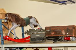 A ROCKING HORSE, approximate height 63cm x length 104cm, together with a 'Remington C' typewriter, a