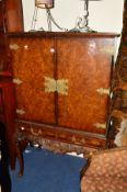 A REPRODUCTION ITALIAN CARVED WALNUT TWO DOOR CABINET on cabriole legs with two drawers, width 101cm
