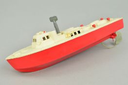 A PLASTIC CLOCKWORK PATROL BOAT, possibly Tri-ang/Penguin, appears largely complete and in working