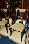 A PAIR OF EDWARDIAN MAHOGANY AND INLAID CHAIRS with swept arms and pierced backs