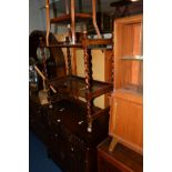 AN OAK LINENFOLD TWO DOOR CABINET, a teak tea trolley and an occasional table (3)