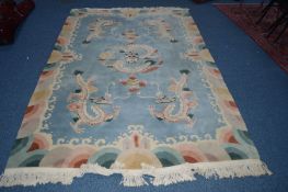 AN ORIENTAL CARPET SQUARE, blue ground with Dragon detail, 280cm x 182cm