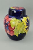 A LARGE MOORCROFT POTTERY GINGER JAR, 'Hibiscus' pattern on blue ground, impressed marks, painted
