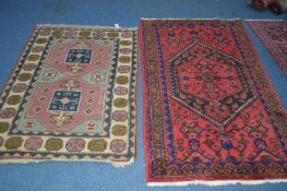 A 20TH CENTURY KUBA STYLE RUG, red and blue ground of a geometric form, 222cm x 134cm, together with