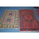 A 20TH CENTURY KUBA STYLE RUG, red and blue ground of a geometric form, 222cm x 134cm, together with