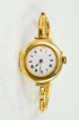 AN EARLY 20TH CENTURY 9CT GOLD WRISTWATCH, the circular head with white dial and Roman numeral