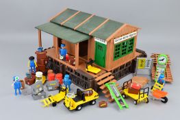AN UNBOXED PLAYMOBIL G SCALE RAILWAY GOODS DEPOT, with a quantity of accessories, appears largely