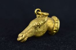 A LATE VICTORIAN SEAL IN THE FORM OF A HORSE'S HEAD, with gilt head and terminal set with an oval