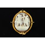 A LATE VICTORIAN CAMEO BROOCH of oval outline, carved to depict The Oath of the Horatii, with some