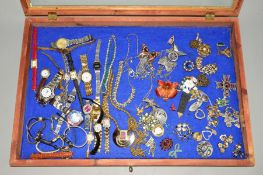 A SELECTION OF COSTUME JEWELLERY AND WATCHES to include necklaces, clip earrings, a Kramer leaf