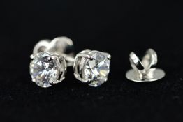 A PAIR OF SWAROVSKI CRYSTAL STUD EARRINGS, each designed as a circular Swarovski within a four