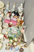 A GROUP OF ORNAMENTS, GLASS VASES, COLLECTORS SPOONS ETC, to include Wade elephant family