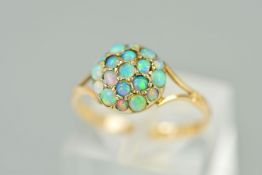 AN EARLY 20TH CENTURY OPAL ROUND CLUSTER RING, round cabochon cut opals, ring size M, stamped '