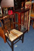 A GEORGIAN MAHOGANY CHIPPENDALE STYLE CARVER CHAIR, a mahogany single door display cabinet and a