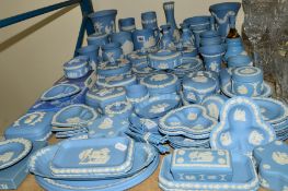 A LARGE COLLECTION WEDGWOOD BLUE JASPERWARES, to include table lighter, vases, tankards, trinkets